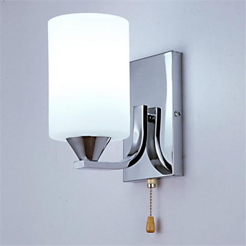Chrome wall sconce with glass shade